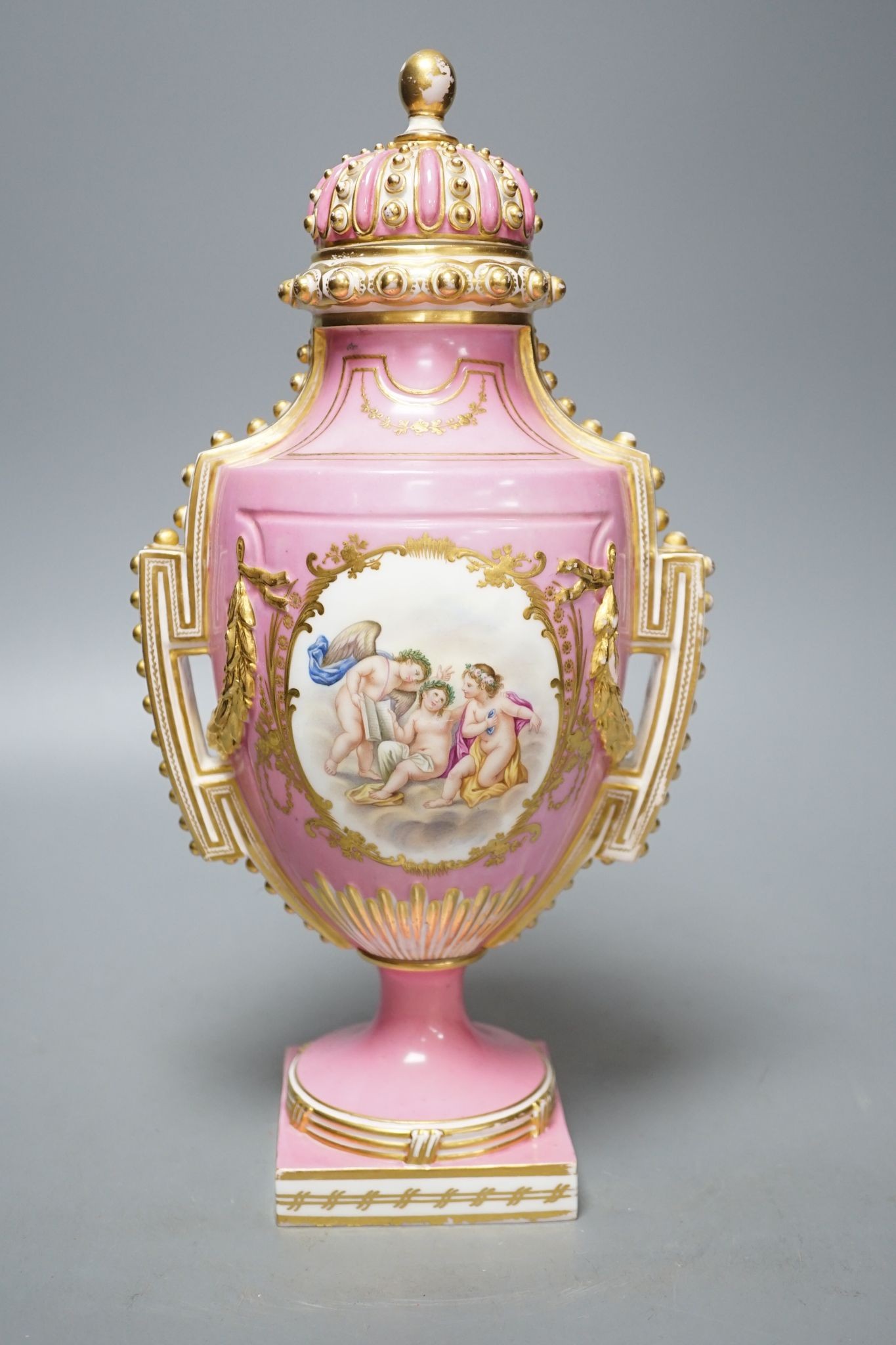 A Coalport two handled vase and cover painted with a Watteauesque scene to one side and a panel of fruit and flowers by William Cook 31cm